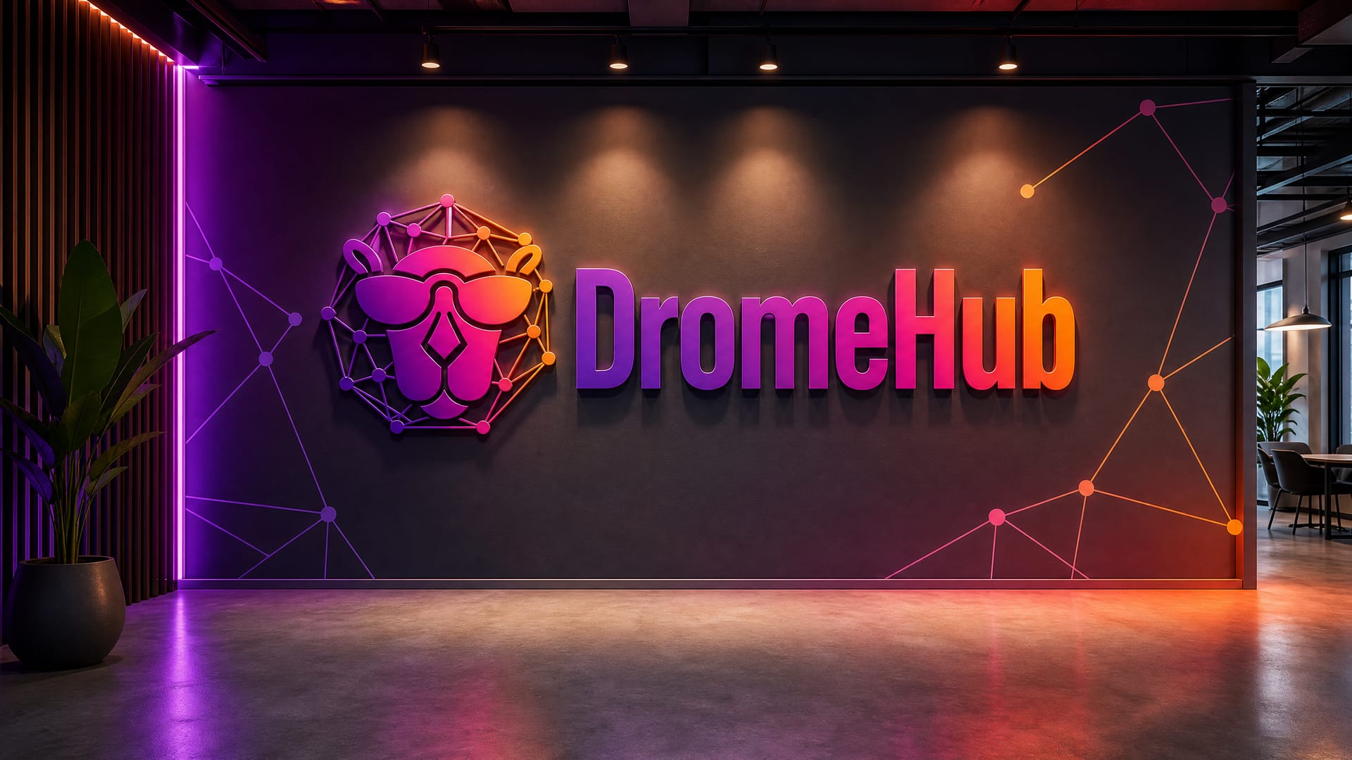 DromeHub team collaborating under illuminated signage